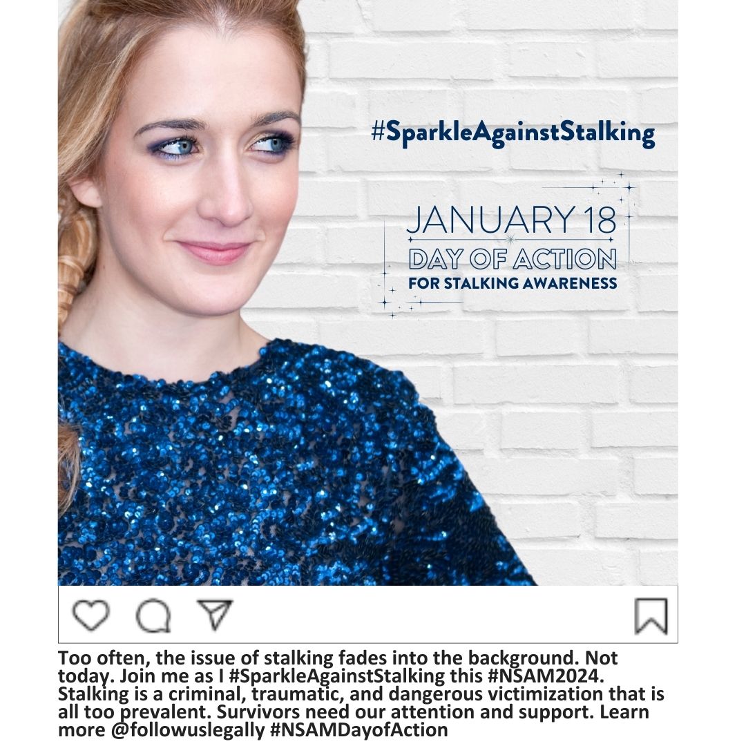 A white woman with blond hair and blue eyes, smiling slightly, wearing a dark blue and black sparkly shirt, standing in front of a white brick wall. Superimposed on the wall are the words "January 18 Day of Action for Stalking Awareness #SparkleAgainstStalking